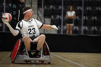 U.S. Army Staff Sgt. Coty Tuck looks to pass the ball inbound during a wheelchair rugby match against Team Navy at the 2025 Department of Defense Warrior Games in Colorado Springs, Colorado, July 22, 2025.