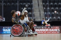U.S. Army Staff Sgt. Derrick Thompson plays defense in the wheelchair rugby match against Team SOCOM during the 2025 Department of Defense Warrior Games at Colorado Springs, Colorado, July 22, 2025.