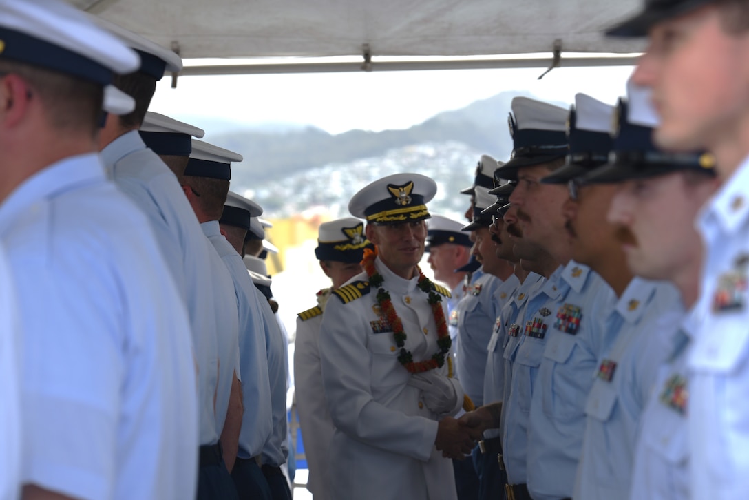 Capt. Brian Krautler and Capt. Dorothy Hernaez conduct a personnel inspection prior to the U.S. Coast Guard Cutter Stratton's (WMSL 752) change of command ceremony while moored at Base Honolulu, July 22, 2025. Krautler will serve as the PAC-3 Operations division officer at Coast Guard Pacific Area, where he will be responsible for directing Coast Guard operations throughout the Pacific theater, ranging from South America to the Arctic and west to Russia and Asia. (U.S. Coast Guard photo by Ensign Sarah Choe)