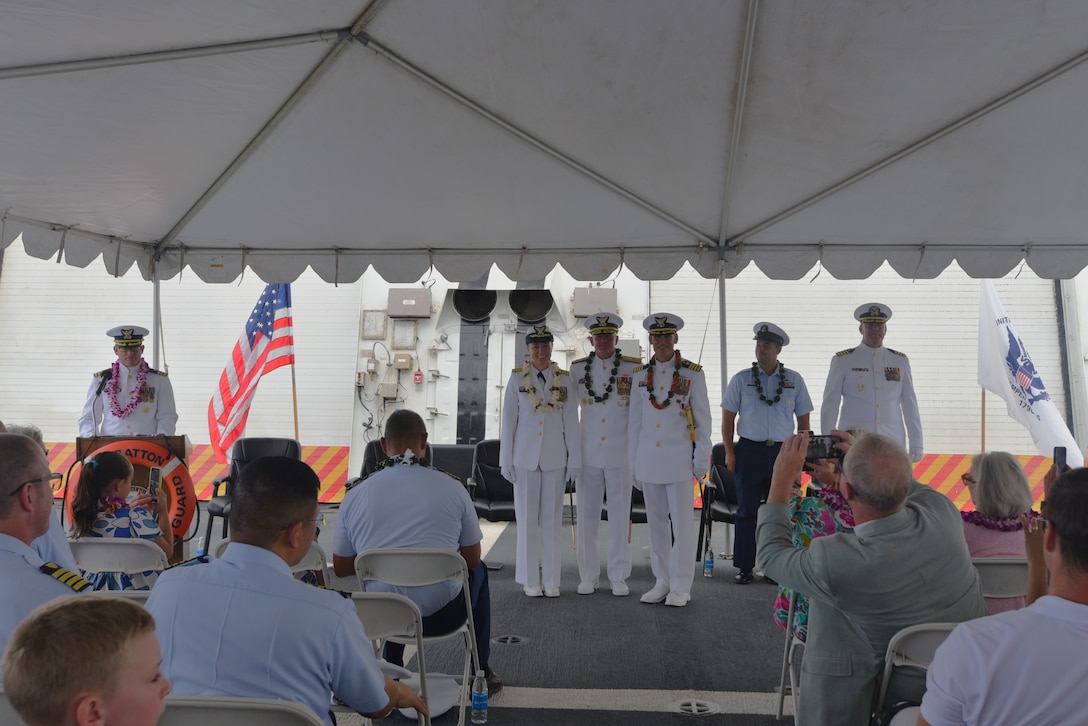 Capt. Dorothy Hernaez (left), Rear Adm. Jeffrey Novak (middle), and Capt. Brian Krautler (right) stand alongside each other on the U.S. Coast Guard Cutter Stratton (WMSL 752) having completed the change of command ceremony while moored at Base Honolulu, July 22, 2025. Commissioned in 2012, Stratton is one of ten legend-class National Security Cutters and one of four homeported in Alameda, California. (U.S. Coast Guard photo by Ensign Sarah Choe)