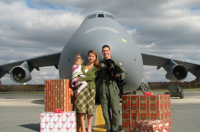 military family in front of jet
