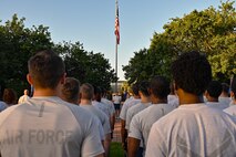 Airmen stand in formation prior to a wing run.