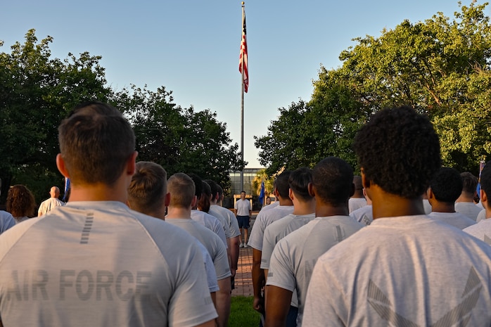 Airmen stand in formation prior to a wing run.