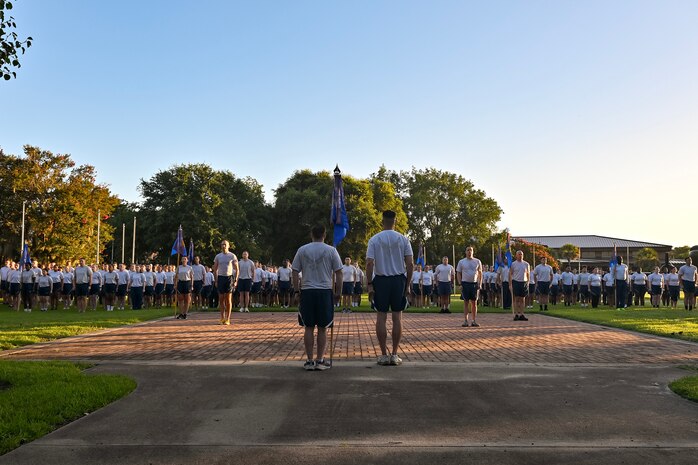 Airmen stand in formation prior to a wing run.