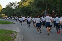 Airmen running down the road during a wing run at Joint Base Charleston.