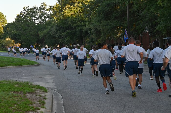 Airmen running down the road during a wing run at Joint Base Charleston.