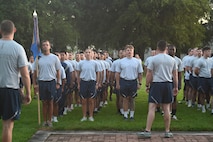 Airmen stand in formation prior to a wing run.