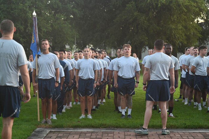 Airmen stand in formation prior to a wing run.