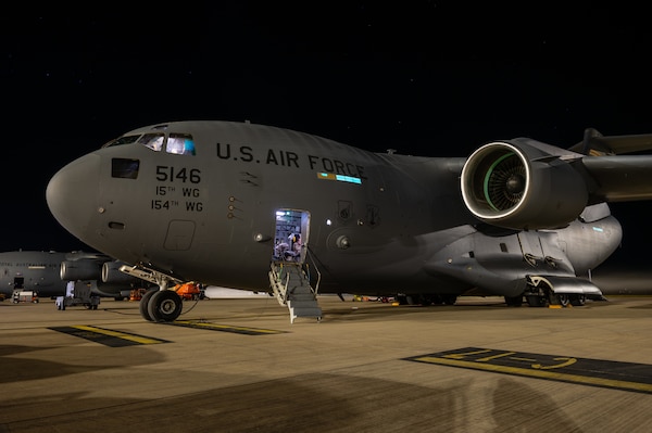 A C-17 Globemaster III assigned to the 15th Wing, Joint Base Pearl Harbor-Hickam, Hawaii, sits on the flight line at Royal Australian Air Force Base Amberley, Queensland, Australia, July 22, 2025, following a joint forcible entry operation during Talisman Sabre 2025.
