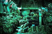 U.S. Army paratroopers, assigned to the 11th Airborne Division, wait together onboard a C-17 Globemaster III before executing a combined joint forcible entry operation in support of Talisman Sabre 25 near Queensland, Australia, July 21, 2025.