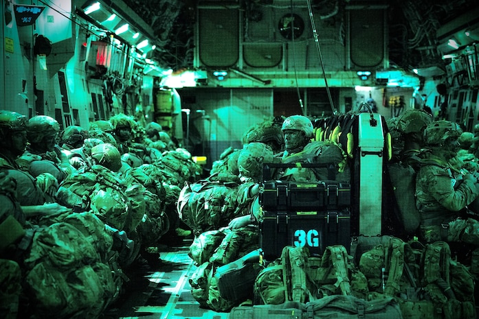 U.S. Army paratroopers, assigned to the 11th Airborne Division, wait together onboard a C-17 Globemaster III before executing a combined joint forcible entry operation in support of Talisman Sabre 25 near Queensland, Australia, July 21, 2025.