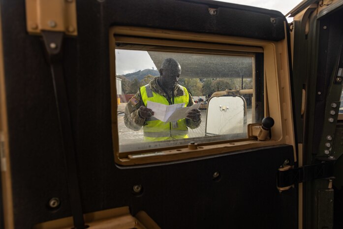 U.S. Army Sfc. Mohammed Awal Ismail with the 8th Theater Sustainment Command works alongside contracted civilian support to load military vehicles and equipment in preparation for exercise Talisman Sabre 25 at south Bandiana, northeast Victoria, Australia, June 15, 2025.