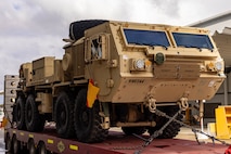Soldiers of the 8th Theater Sustainment Command work alongside contracted civilian support to load military vehicles and equipment in preparation for exercise Talisman Sabre 25 at south Bandiana, northeast Victoria, Australia, June 15, 2025.