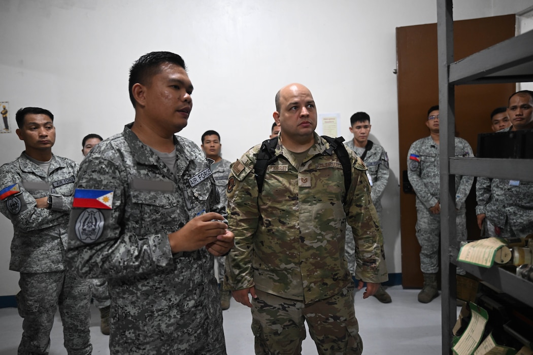 U.S. Air Force Tech. Sgt. Randy Russe-Rodriguez, 36th Tactical Advisor Squadron air advisor, speaks with Philippine Air Force members during a subject matter expert exchange at Basa Air Base, Philippines, July 10, 2025.