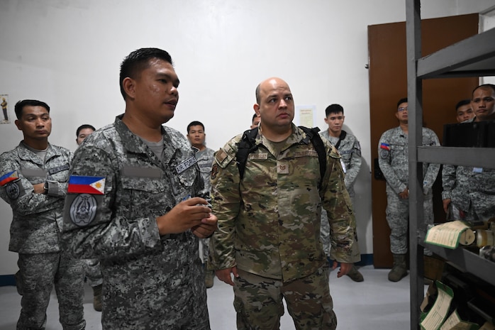 U.S. Air Force Tech. Sgt. Randy Russe-Rodriguez, 36th Tactical Advisor Squadron air advisor, speaks with Philippine Air Force members during a subject matter expert exchange at Basa Air Base, Philippines, July 10, 2025.