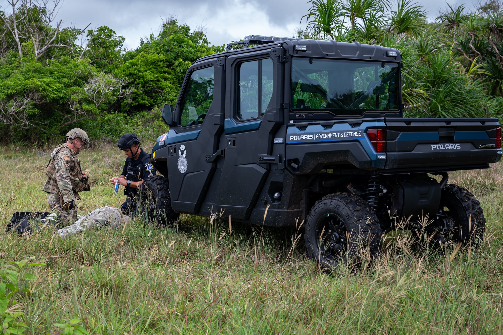 Photo of patrolmen performing tactical combat casualty care