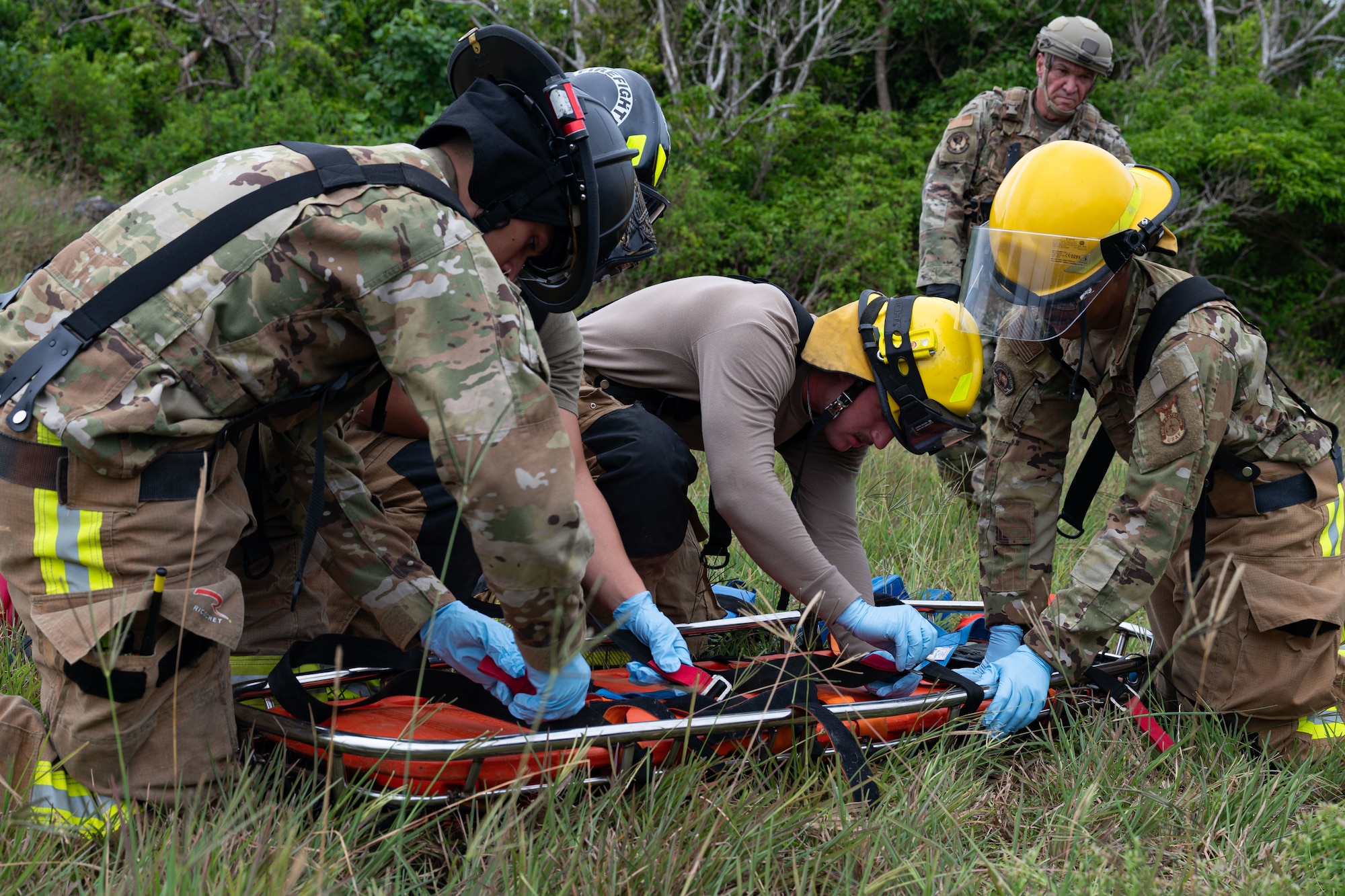 Photo of firefighters preparing a gurney