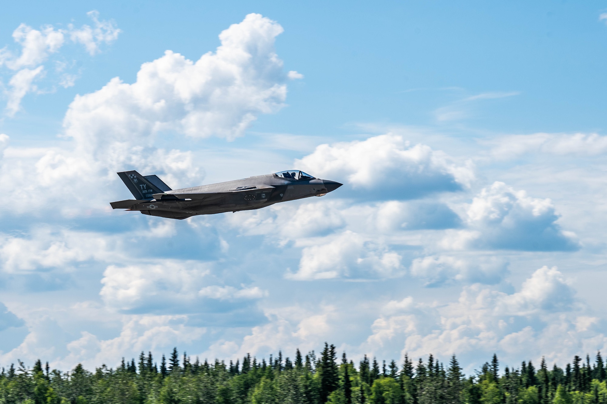 A F-35A Lightning II assigned to the 95th Fighter Squadron takes flight during Red Flag-Alaska 25-3 at Eielson Air Force Base, Alaska, July 24, 2025.