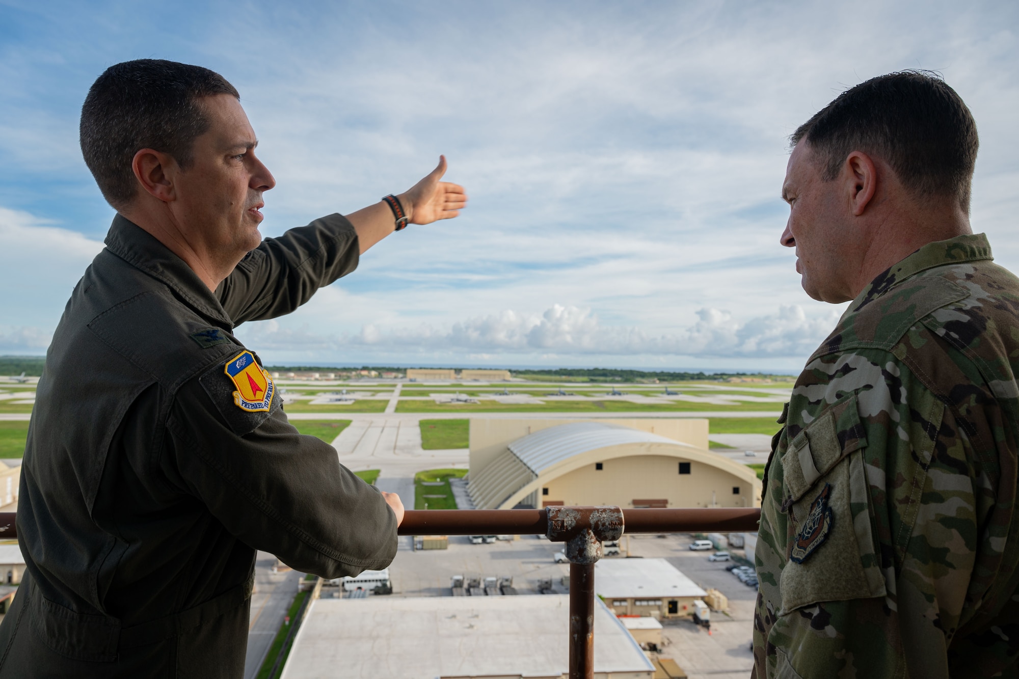 Photo of the 36th Wing commander pointing at the flightline