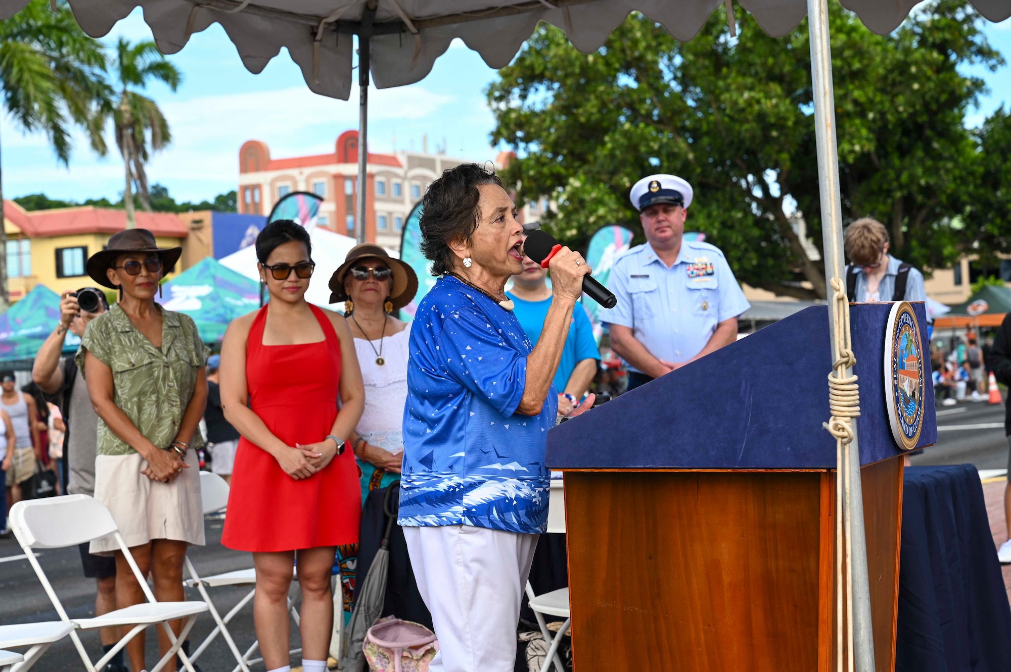 Photo of Guam's governor giving opening remarks during a parade