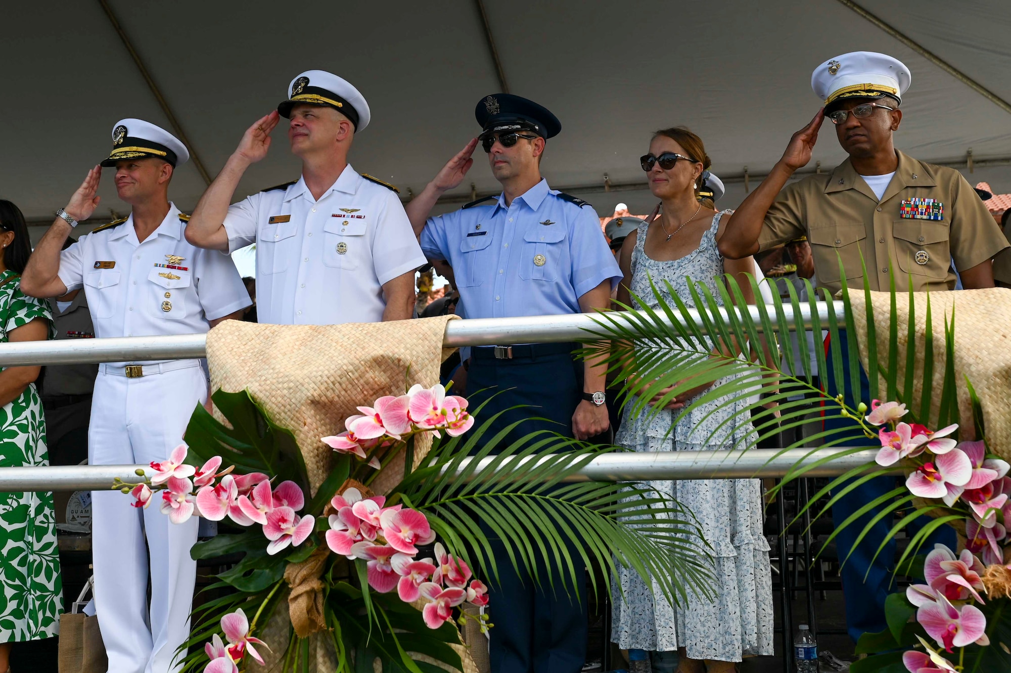 Photo of leadership returning salutes during a parade