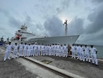 Indian Navy and Indian Coast Guard personnel alongside U.S. Navy sailors pose in front of the pathfinder class oceanographic survey ship USNS Bowditch (T-AGS 62) following a ship tour during a scheduled port visit to Sri Vijaya Puram, India, July 25, 2025.