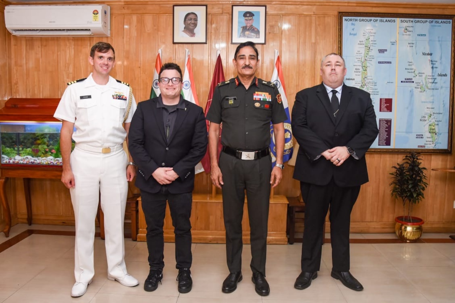 U.S. Navy Cmdr. Daniel Foose, Assistant Naval Attache, Lawrence Haselmaier, Senior Naval Oceanographic Office Representative aboard the pathfinder class oceanographic survey ship USNS Bowditch (T-AGS 62), Lieutenant General Dinesh Singh Rana, Commander-in-Chief, Andaman and Nicobar Command, and David Mitchell Captain aboard USNS Bowditch pose for a photo during a scheduled port visit to Sri Vijaya Puram, India, July 25, 2025.