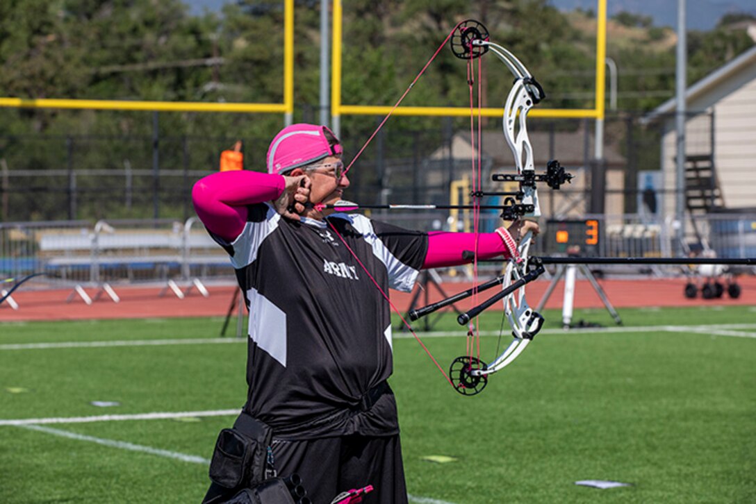 U.S. Army Master Sgt. Jodi Pyle-Vandersys aims her arrow at a target during the archery event at the 2025 Department of Defense Warrior Games in Colorado Springs, Colorado, July 25, 2025.
