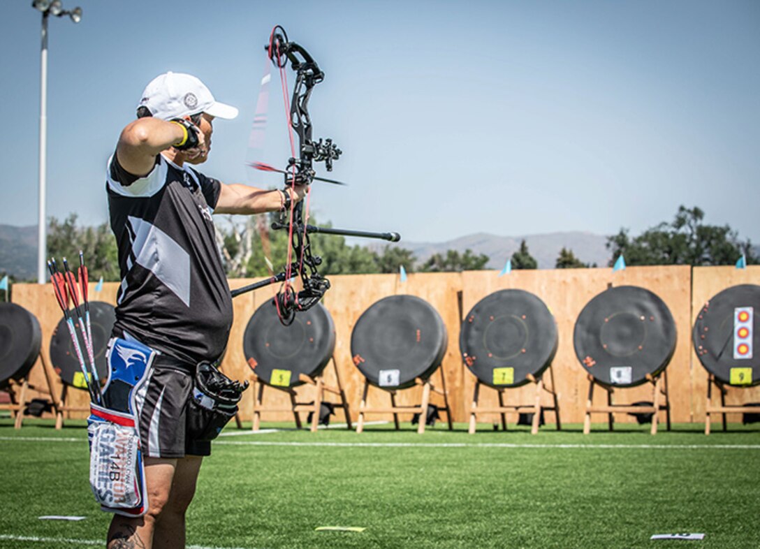 U.S. Army Chief Warrant Officer 4 Joann Tsuhako, shoots an arrow at her target in the archery event during the 2025 Department of Defense Warrior Games, Colorado Springs, Colorado, July 25, 2025.
