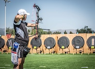 U.S. Army Chief Warrant Officer 4 Joann Tsuhako, shoots an arrow at her target in the archery event during the 2025 Department of Defense Warrior Games, Colorado Springs, Colorado, July 25, 2025.