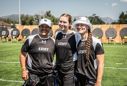 U.S. Army Chief Warrant Officer 4 Joann Tsuhako, left, Capt. Samantha Frey, center, and Sgt. Bianca Hayden, right,  pose for a photo at the end of the archery event at the 2025 Department of Defense Warrior Games, Colorado Springs, Colorado, July 25, 2025.