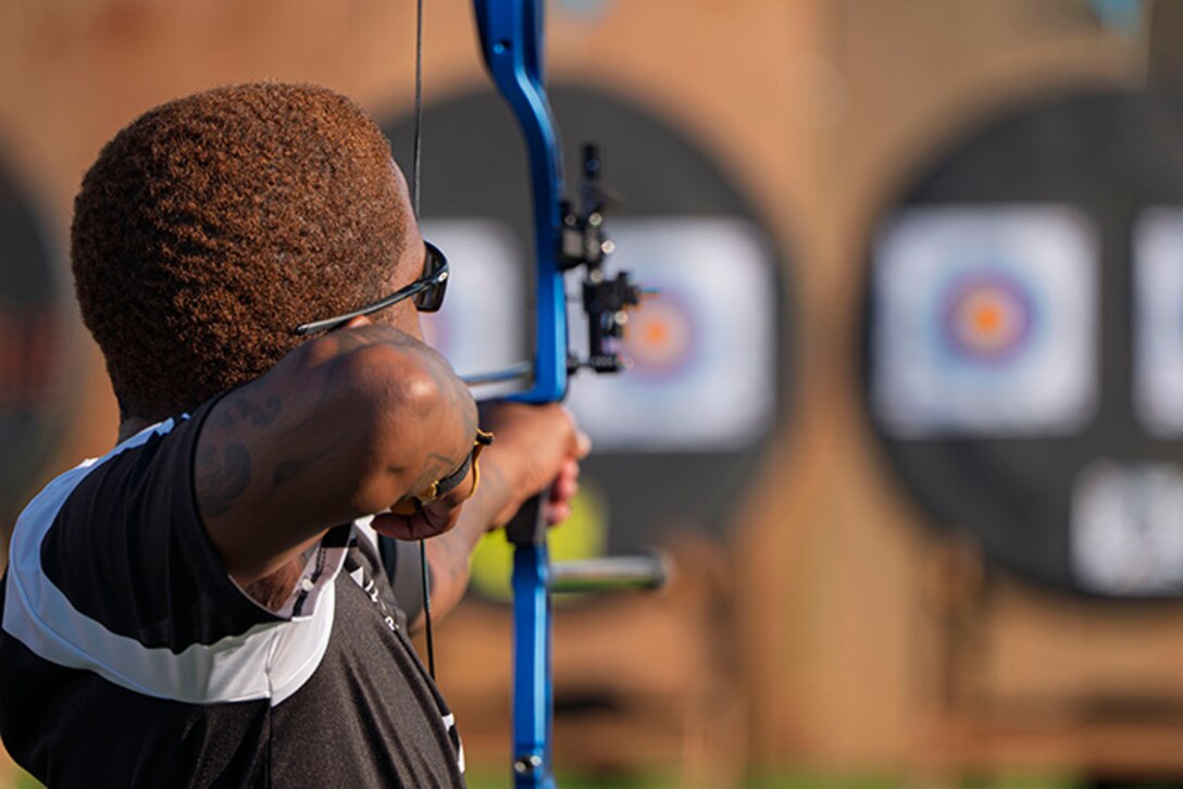 U.S. Army Staff Sgt. Allaijah Churchwell competes with a recurve bow in the archery event during the 2025 Department of Defense Warrior Games at Washburn Field in Colorado Springs, Colorado, July 25, 2025.
