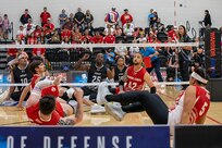 Team Marine Corps attempts to score against Team Army during a sitting volleyball match at the 2025 Department of Defense Warrior Games, Colorado Springs, Colorado, July 25, 2025.