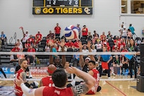 Team Marine Corps serves the ball to Team Army during a sitting volleyball match at the 2025 Department of Defense Warrior Games, Colorado Springs, Colorado, July 25, 2025.