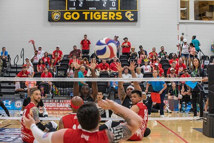 Team Marine Corps serves the ball to Team Army during a sitting volleyball match at the 2025 Department of Defense Warrior Games, Colorado Springs, Colorado, July 25, 2025.