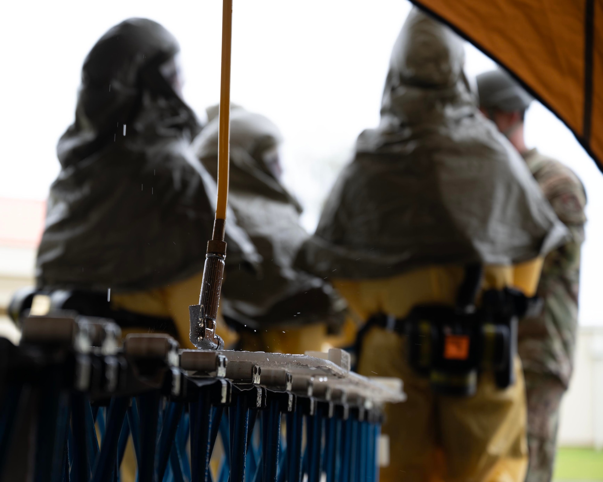 U.S. Air Force Airmen assigned to the 36th Medical Group discuss decontamination procedures during exercise Resolute Force Pacific 2025 at Andersen Air Force Base, Guam, July 18, 2025.