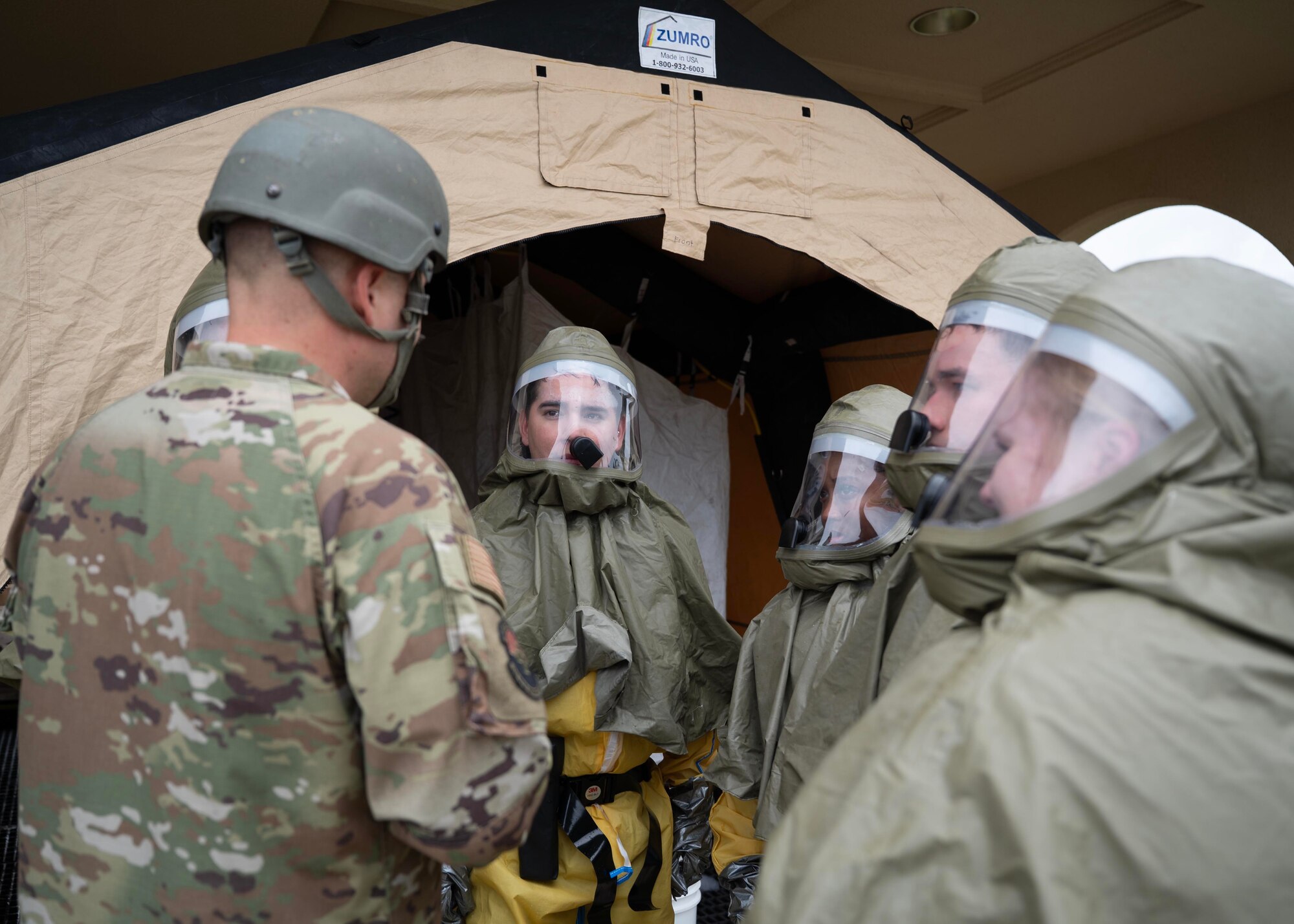 U.S. Air Force Airmen assigned to the 36th Medical Group receive feedback on decontamination procedures following mass casualty training during exercise Resolute Force Pacific 2025 at Andersen Air Force Base, Guam, July 18, 2025.