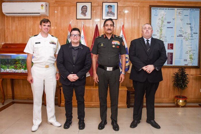 U.S. Navy Cmdr. Daniel Foose, Assistant Naval Attache, Lawrence Haselmaier, Senior Naval Oceanographic Office Representative aboard the pathfinder class oceanographic survey ship USNS Bowditch (T-AGS 62), Lieutenant General Dinesh Singh Rana, Commander-in-Chief, Andaman and Nicobar Command, and David Mitchell Captain aboard USNS Bowditch pose for a photo during a scheduled port visit to Sri Vijaya Puram, India, July 25, 2025.