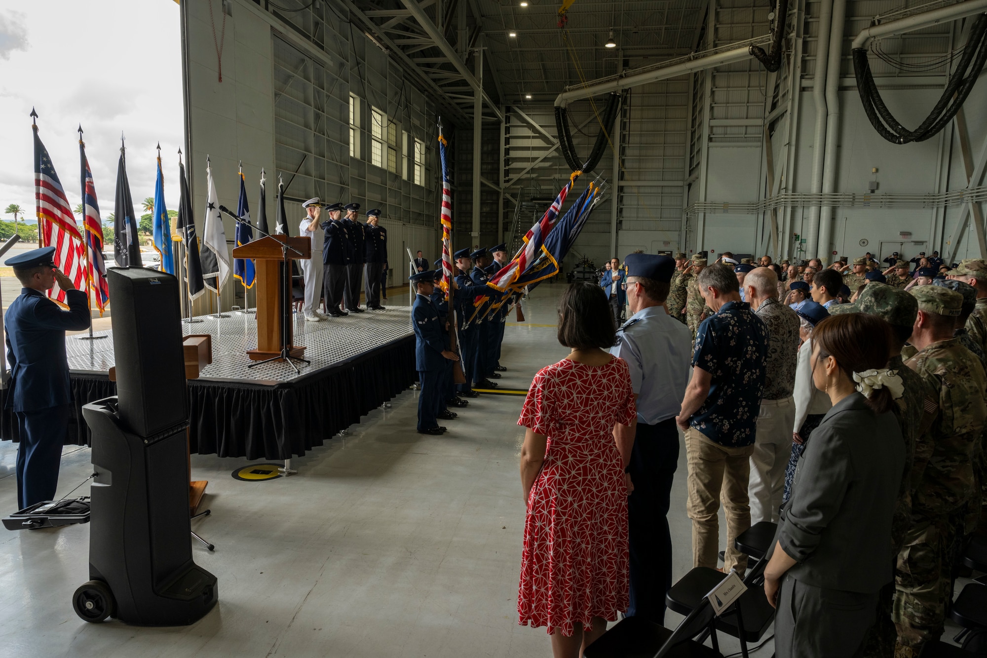 A crowd stands for the national anthem