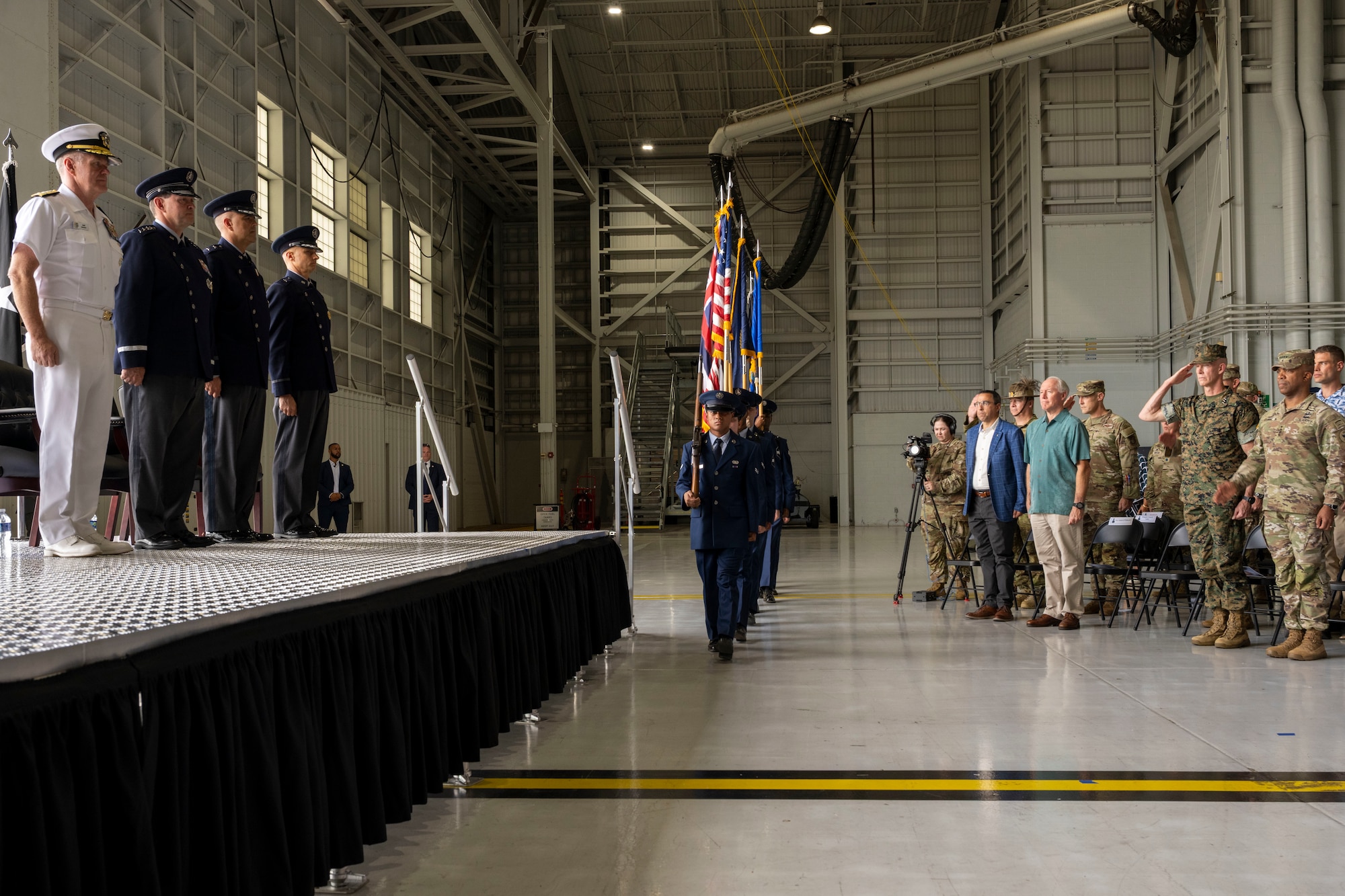 A color guard marches with several flags