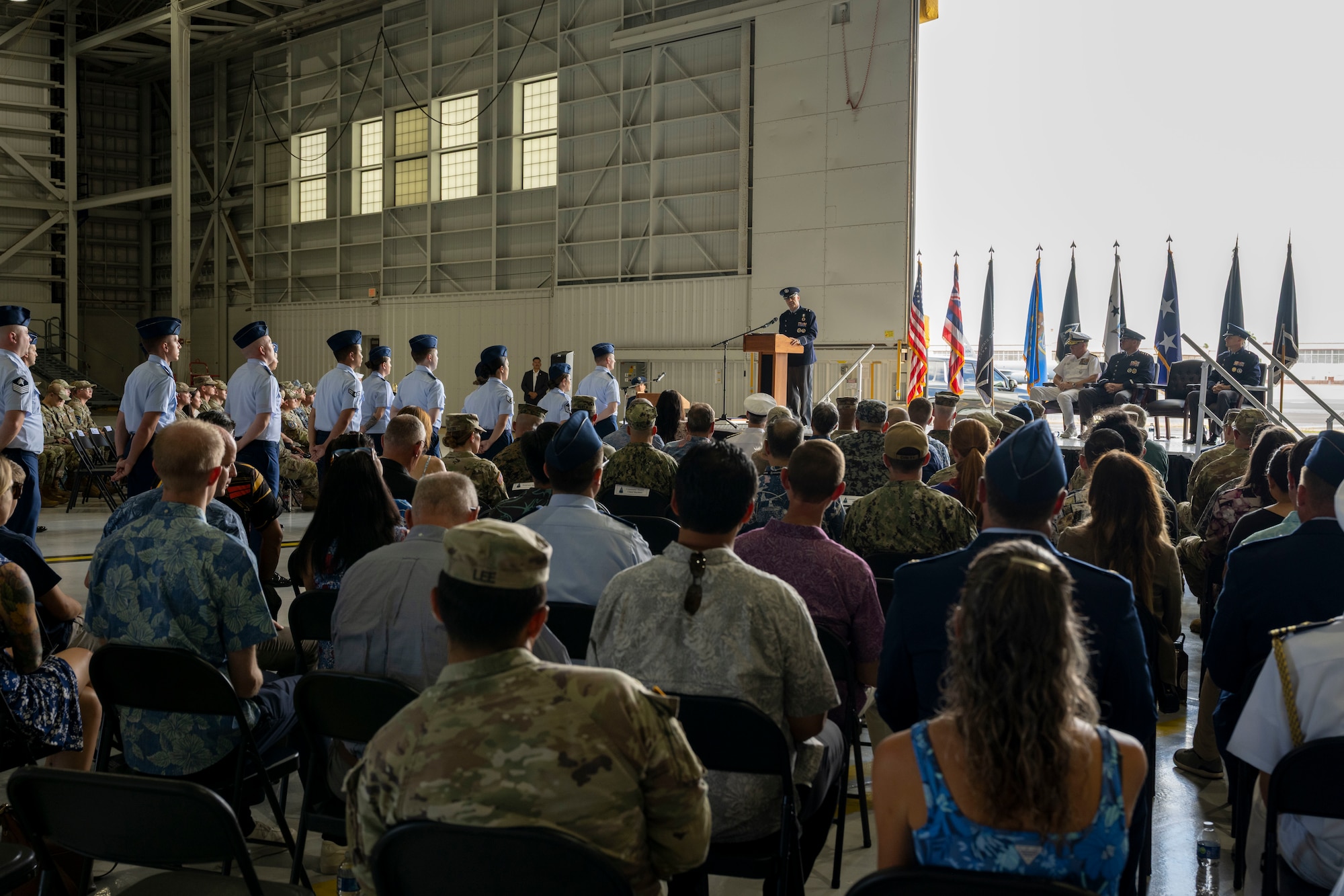 A crowd observes a military ceremony