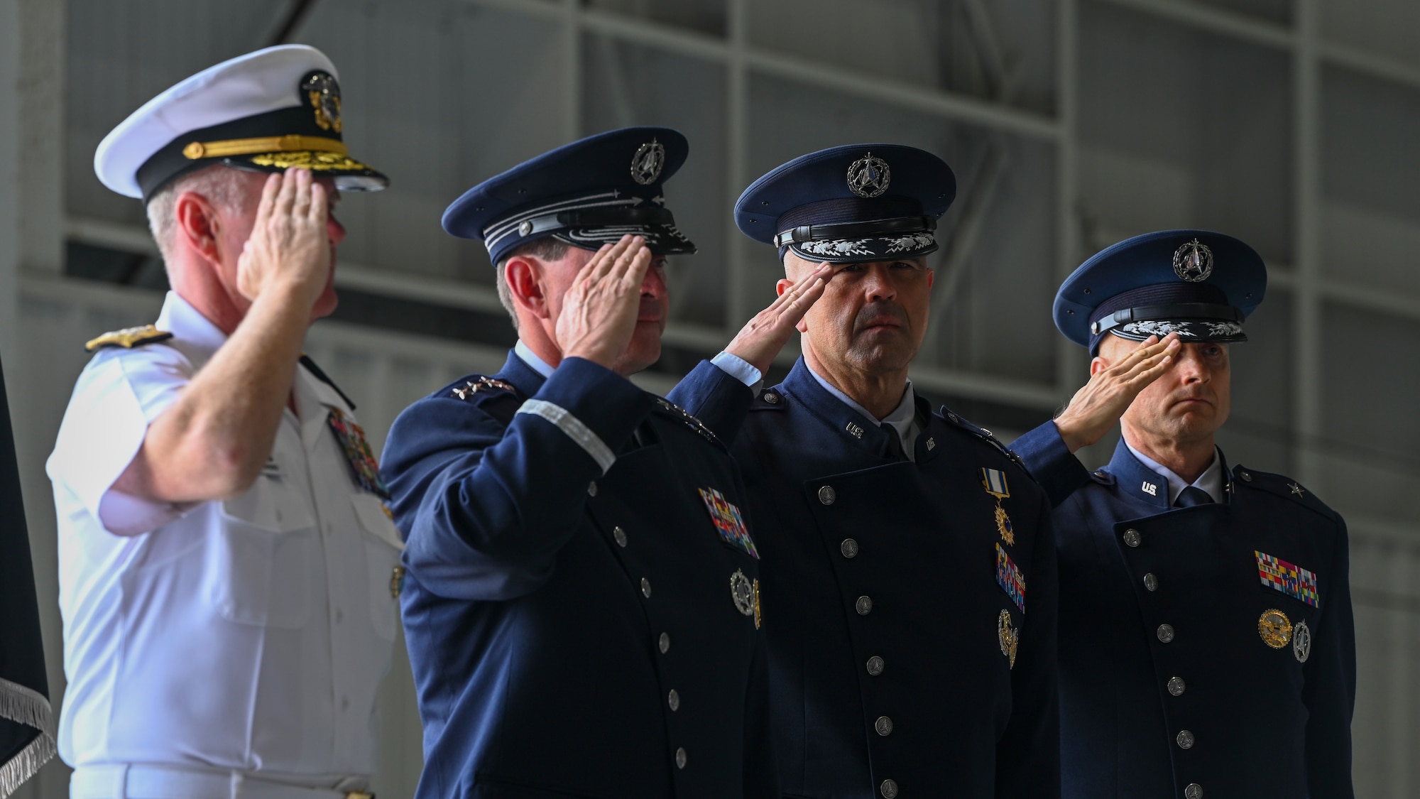 A group of military officers salute