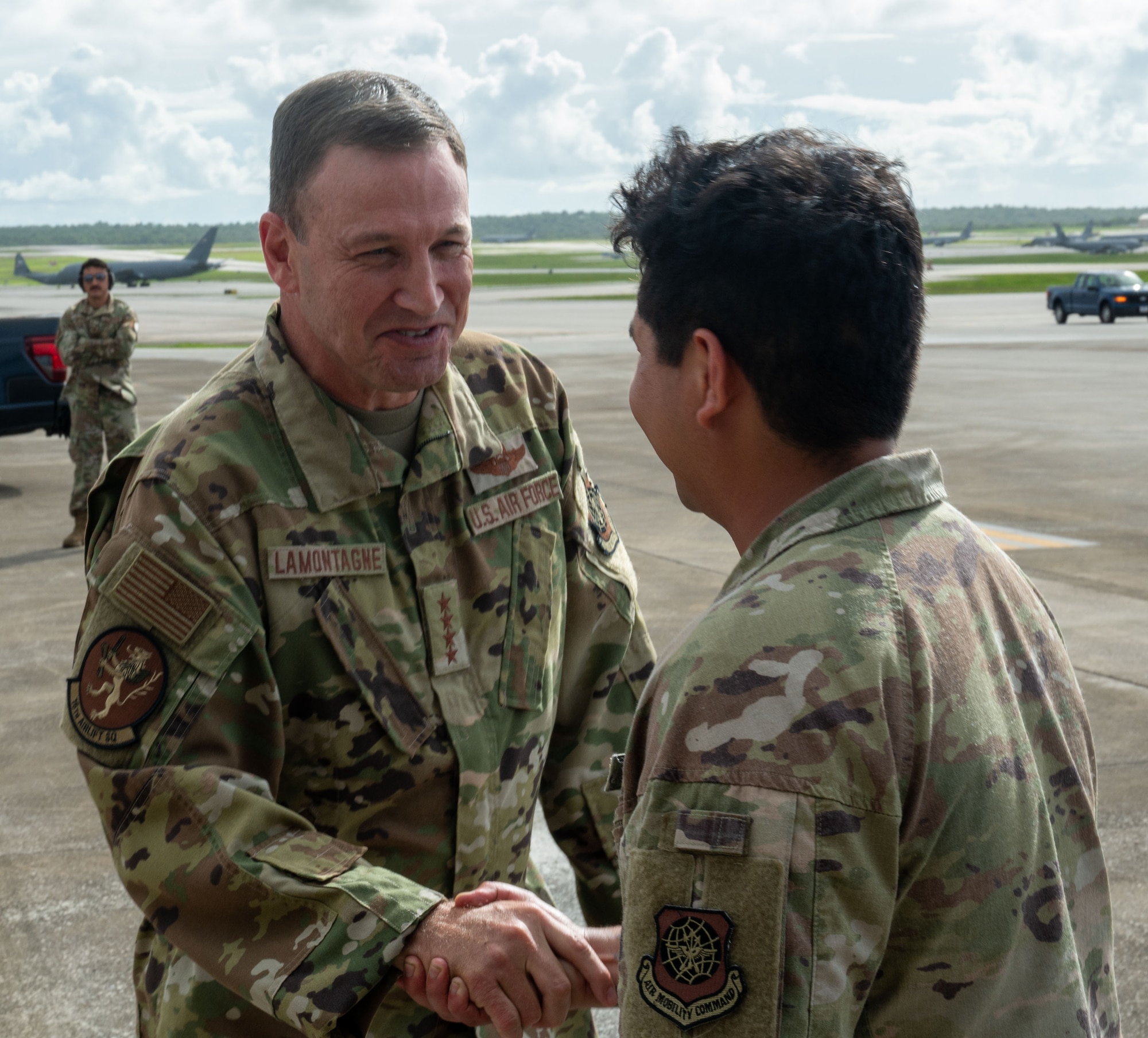 U.S. Air Force Gen. Johnny Lamontagne, commander of Air Mobility Command, says farewell to a C-17 crew member after arriving at Andersen Air Force Base, Guam.