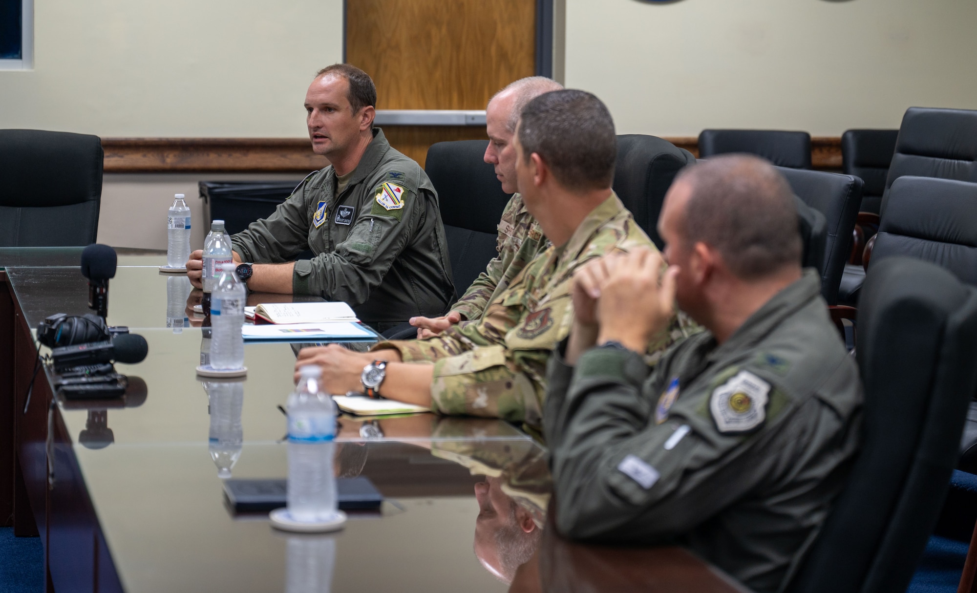 U.S. Air Force Col. Matthew Johnston, 354th Air Expeditionary Wing commander, answers questions from local reporters about the Department-Level Exercise series during a roundtable talk at Andersen Air Force Base, Guam.
