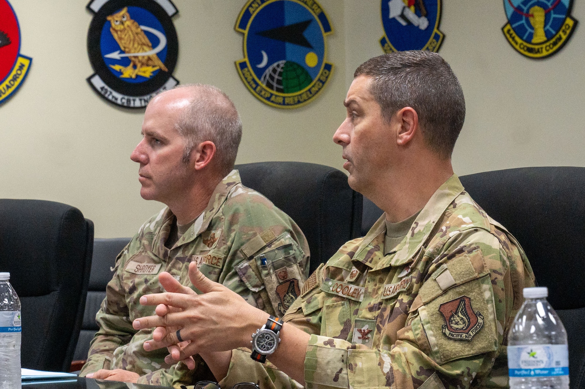 36th Wing base leadership are seen answering questions from local Guam reporters about the Department-Level Exercise series in the 36th Wing headquarters conference room.