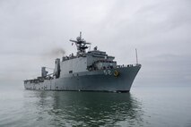 LAE, Papua New Guinea (July 26, 2025) – The Harpers Ferry-class amphibious dock landing ship USS Pearl Harbor (LSD 52) arrives in Lae, Papua New Guinea, in support of Pacific Partnership, July 26, 2025