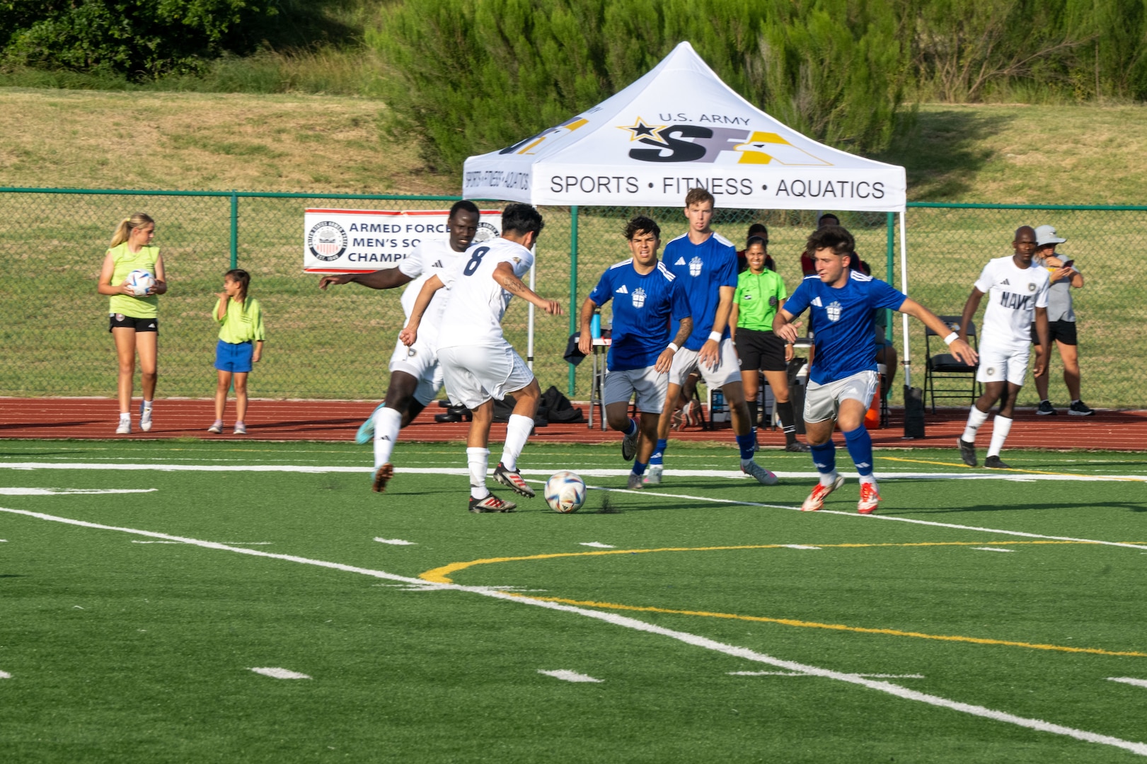 FORT HOOD, TEXAS (July 27, 2025) U.S. Navy Petty Officer 2nd Class Joseph Jaden, forward for the U.S. Navy Armed Forces Sports Men’s Soccer team, dribbles the ball down the field during the Armed Forces Men’s Soccer Championship, July, 27, 2025 at Phantom Warrior Stadium, Fort Hood Texas. Military service teams, Army, Navy, and Air Force compete in a bracket tournament for the championship title. Armed Forces Sports fosters goodwill by promoting physical fitness, providing competitive opportunities for military athletes at national and international levels, enhancing recruitment and retention through sports diplomacy, and building strategic partnerships with allied nations. (U.S. Department of Defense photo by Mass Communication Specialist 2nd Class Theodore C. Lee)