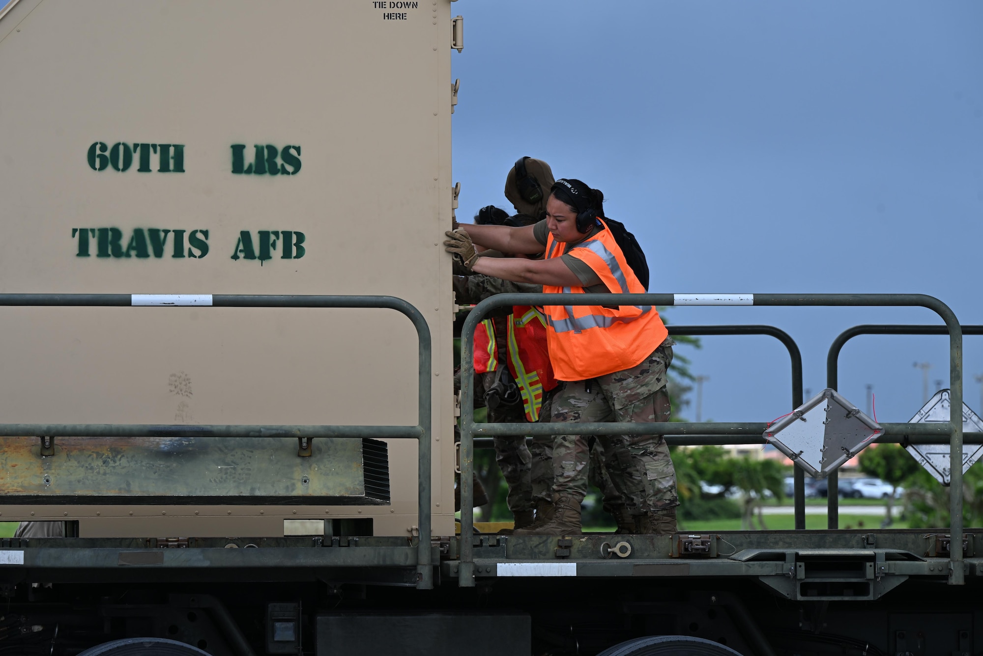 Pallets are rapidly offloaded from a U.S. Air Force C-17 Globemaster III assigned to the 21st Airlift Squadron, Travis Air Force Base, Calif., during engine running offload training at Andersen Air Force Base, Guam, July 10, 2025. The training tested agile logistics support and contingency mobility, contributing to exercise Resolute Force Pacific. The REFORPAC exercise is part of the first-in-a-generation Department-Level Exercise series, a new way of conducting operations in a contested, dynamic environment to build capabilities making a stronger, more lethal deterrent force. (U.S. Air Force photo by Senior Airman Audree Campbell)