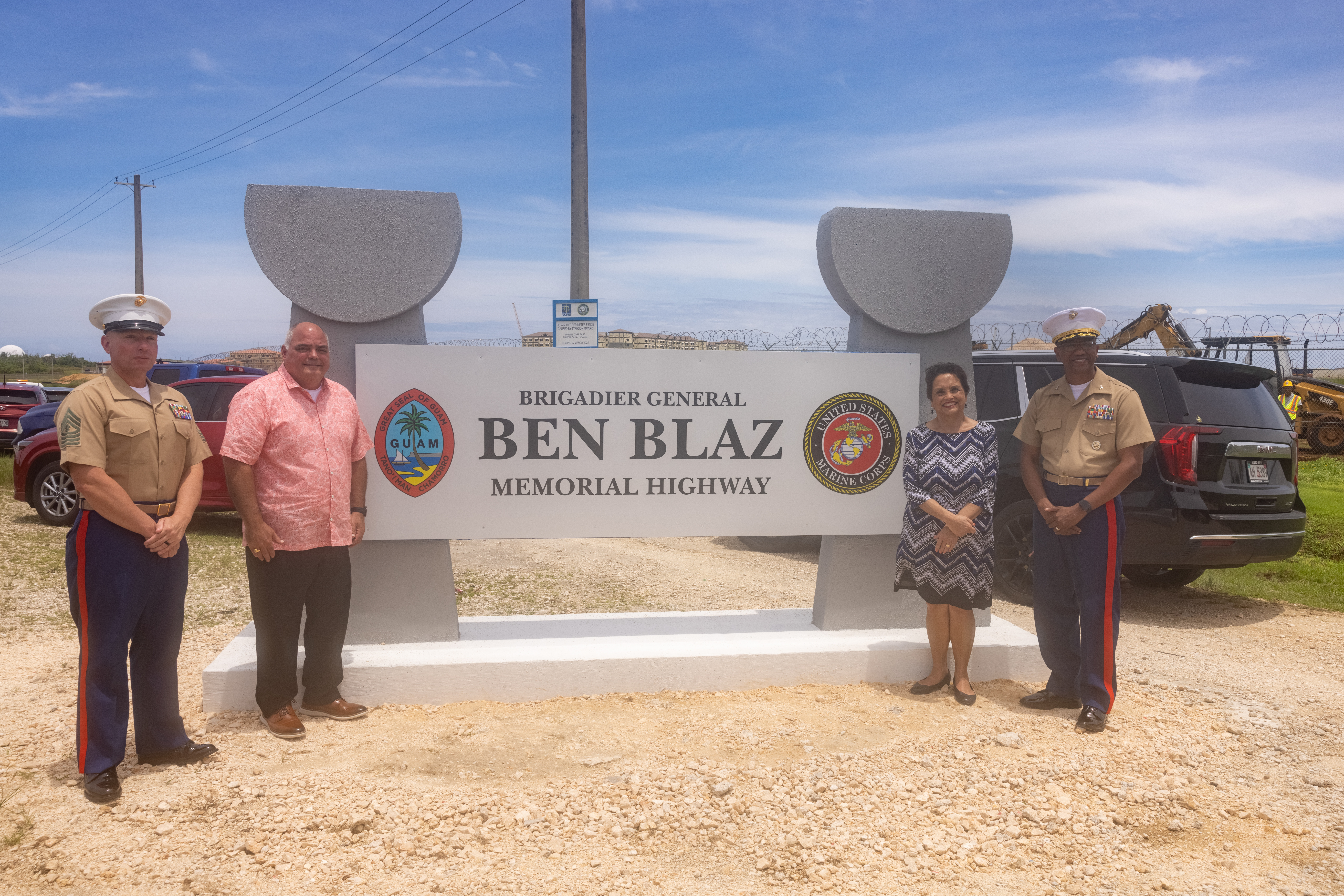From left to right, U.S. Marine Corps Master Gunnery Sgt. Christopher Krivenko, acting senior enlisted advisor of Marine Corps Base Camp Blaz, Senator Chris Dueñas, the Honorable Lourdes A. Leon Guerrero, Governor of Guam and U.S. Marine Corps Col. Richard D. Marshall Jr., commanding officer of MCB Camp Blaz, pose for a photo at the new highway sign during the Brig. Gen. Ben Blaz Memorial Highway renaming ceremony in Dededo, Guam, July 28, 2025. The naming of Brig. Gen. Ben Blaz Memorial Highway is a heartfelt tribute to a distinguished individual who represents the dedication to service, professionalism, and local pride that Camp Blaz aspires to uphold. (U.S. Marine Corps photo by Lance Cpl. Afton Smiley)