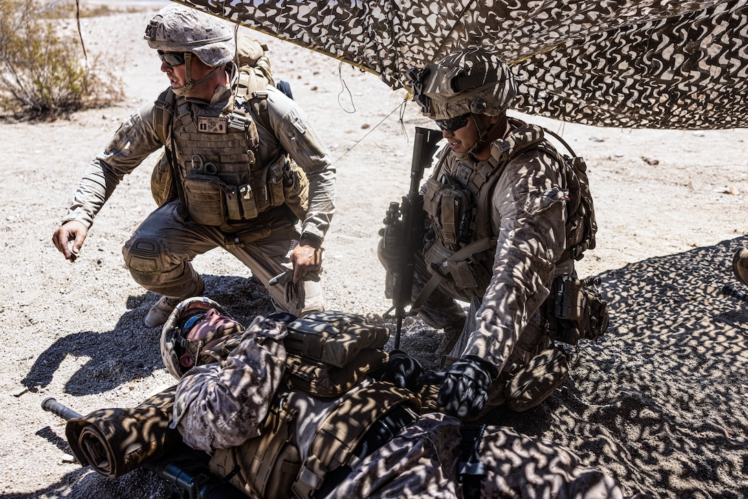 U.S. Navy Corpsmen with Combat Logistics Battalion 8, Combat Logistic Regiment 2, 2d Marine Logistics Group performs a triage for damage control resuscitation drills during Service Level Training Exercise 4-25, at Marine Corps Air-Ground Combat Center, Twentynine Palms, California, July 24, 2025. SLTE 4-25 is designed to be a challenging, realistic training environment that produces combat-ready forces capable of operating as an integrated Marine Air Ground Task Force across all domains of military operations. (U.S. Marine Corps photo by Lance Cpl. Judith Ann Lazaro)